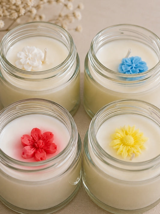 Close-up of the handcrafted soy wax candles highlighting the smooth wax finish, decorative detailing, and cotton wicks.