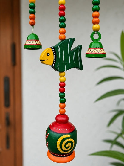 Close-up of the ceramic bells, handcrafted macramé knots, wooden beads, and decorative detailing.
