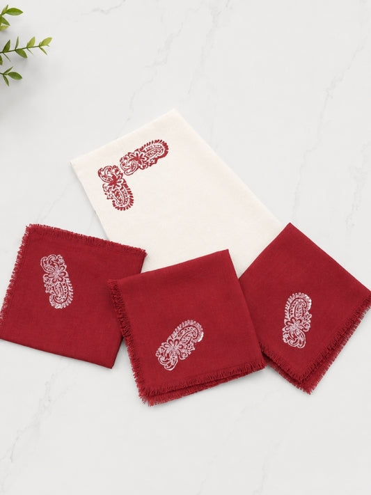 Hand-painted cotton dining table mat and napkin set featuring a red floral design, including four table mats measuring approximately 18 by 13 inches and four matching 14-inch square napkins.
