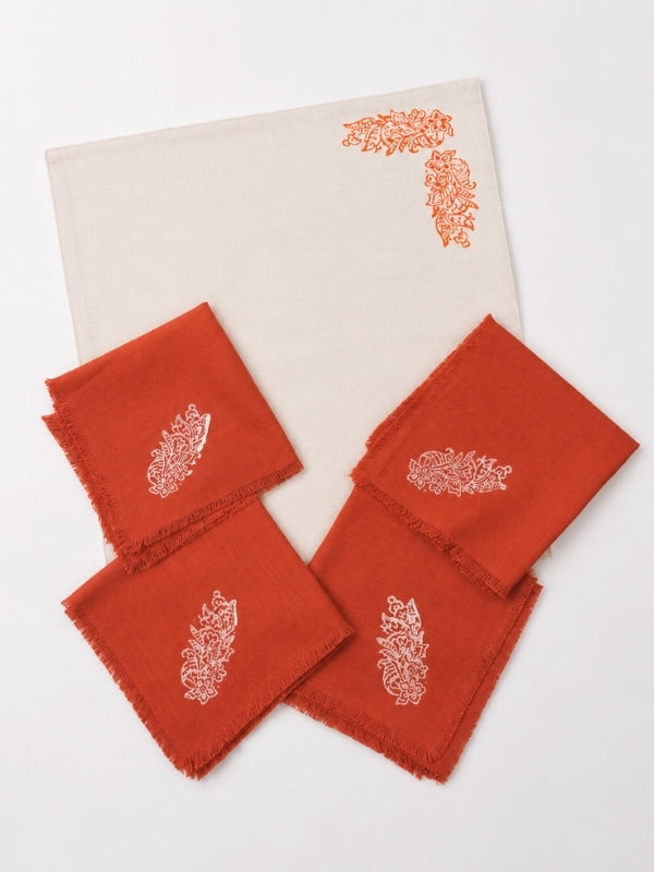 Hand-painted cotton dining table mat and napkin set featuring an orange floral design, including four table mats measuring approximately 18 by 13 inches and four matching 14-inch square napkins.
