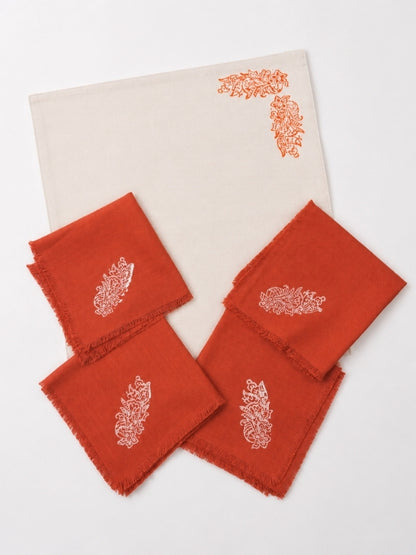 Hand-painted cotton dining table mat and napkin set featuring an orange floral design, including four table mats measuring approximately 18 by 13 inches and four matching 14-inch square napkins.
