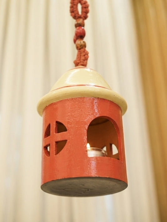 Angled view of the bird house tea light holder displaying its three-dimensional structure and decorative detailing.