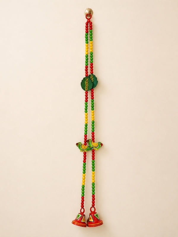 Handcrafted wooden decorative hanging featuring a colourful parrot design with hand-painted artwork and decorative beads, designed for wall or door décor.