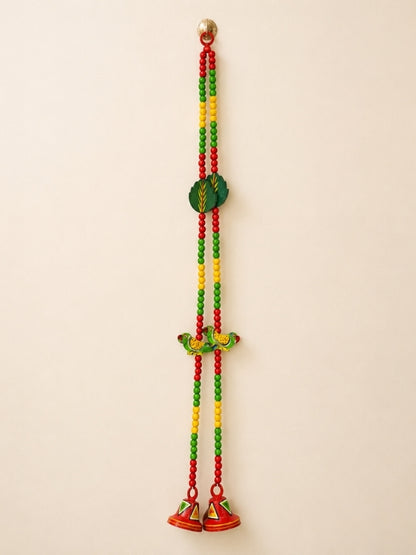 Handcrafted wooden decorative hanging featuring a colourful parrot design with hand-painted artwork and decorative beads, designed for wall or door décor.