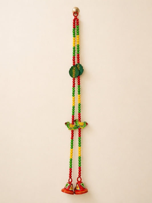 Handcrafted wooden decorative hanging featuring a colourful parrot design with hand-painted artwork and decorative beads, designed for wall or door décor.