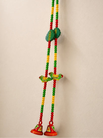 Angled view of the parrot decorative hanging displaying its handcrafted construction and decorative elements.
