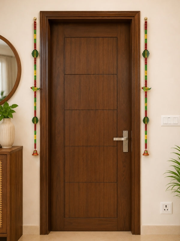 Handcrafted parrot decorative hanging displayed on a wall, adding colour and handcrafted charm to the living space.