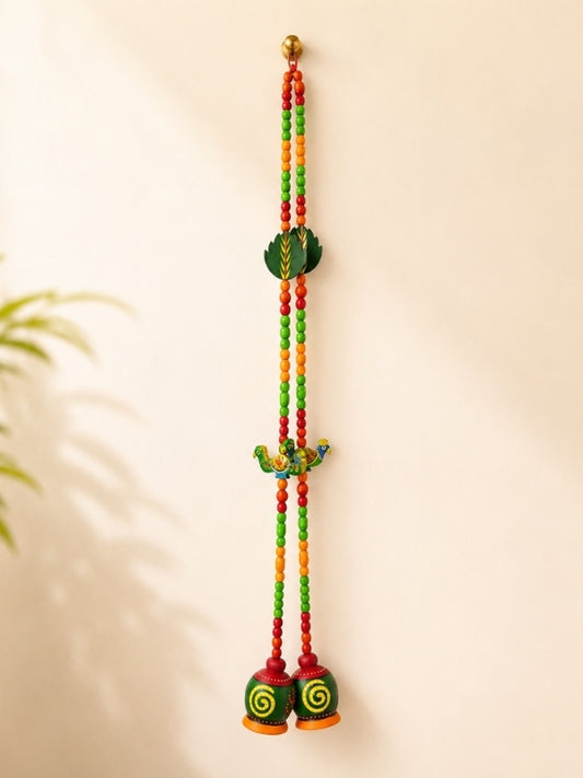 Handcrafted wooden decorative hanging featuring a colourful peacock design with hand-painted artwork and decorative beads, designed for wall or door décor.