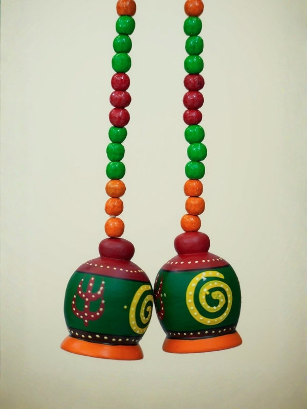 Close-up of the handcrafted peacock decorative hanging highlighting the painted details, bead work, and wooden finish.