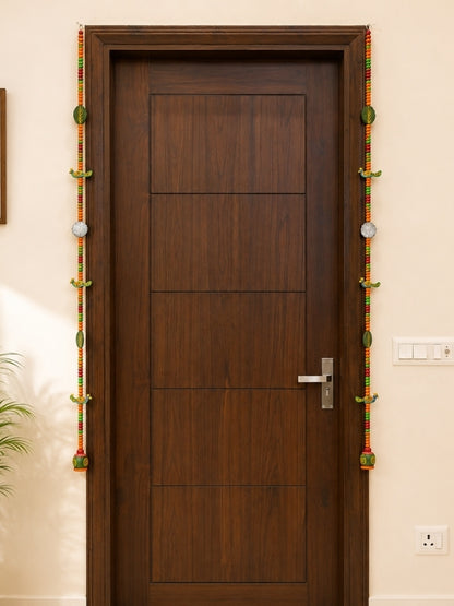 Handcrafted peacock decorative hanging displayed on a wall, adding an artistic and decorative accent to the home.
