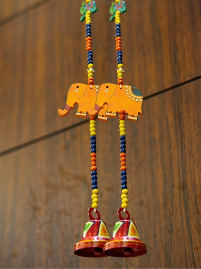 Angled view of the elephant decorative hanging showing its handcrafted structure and decorative arrangement.
