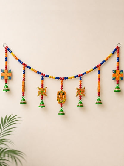 Handcrafted wooden wall hanging featuring a hand-painted Lord Ganesha design with decorative hanging cord, created for home and pooja décor.