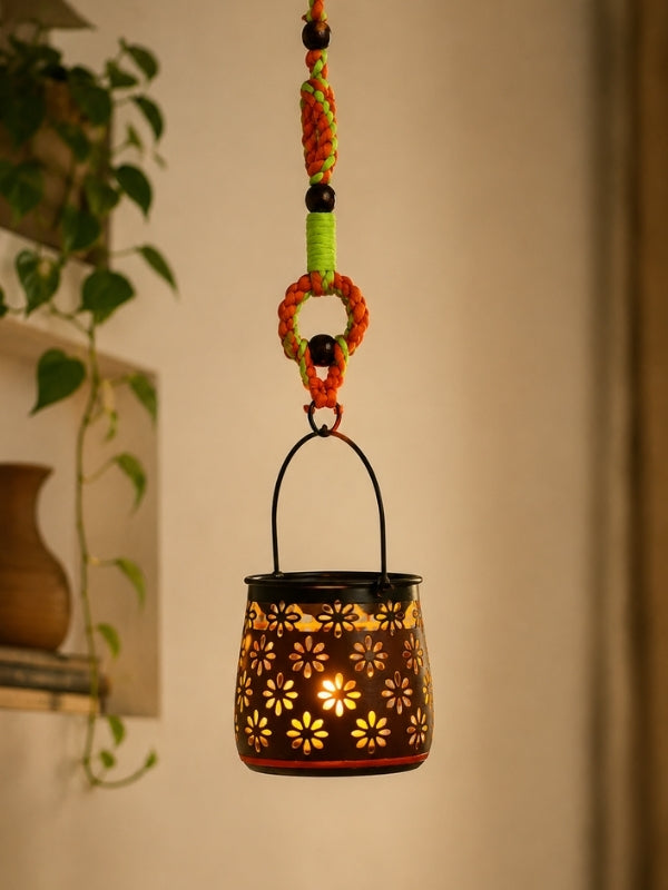 Handcrafted metal tealight holder displayed indoors with an electric LED tealight, adding warmth and handcrafted elegance to the décor.

