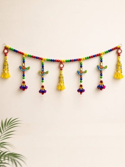 Handcrafted wooden wall hanging featuring a colourful hand-painted peacock design with decorative hanging cord, designed for wall décor.
