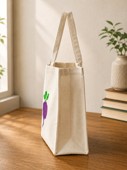 Angled view of the beetroot-design tote bag showing the 4-inch gusset, shoulder handles, and spacious structure.
