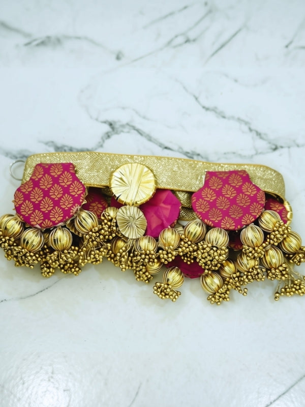 Close-up of the handcrafted Gota Patti toran highlighting the fabric detailing, decorative beads, and handcrafted finish.
