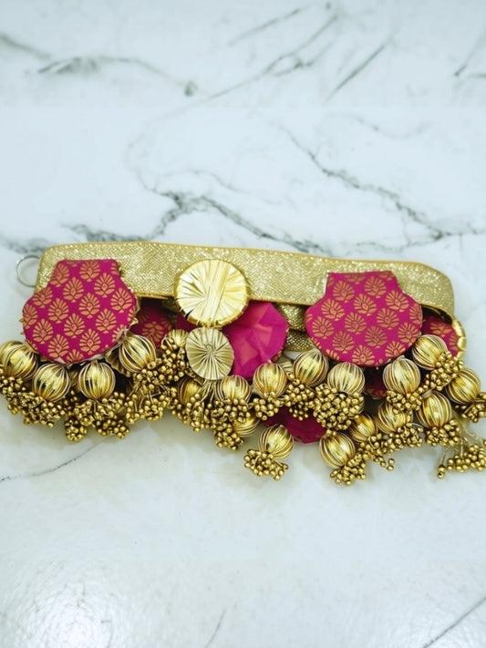 Close-up of the handcrafted Gota Patti toran highlighting the fabric detailing, decorative beads, and handcrafted finish.
