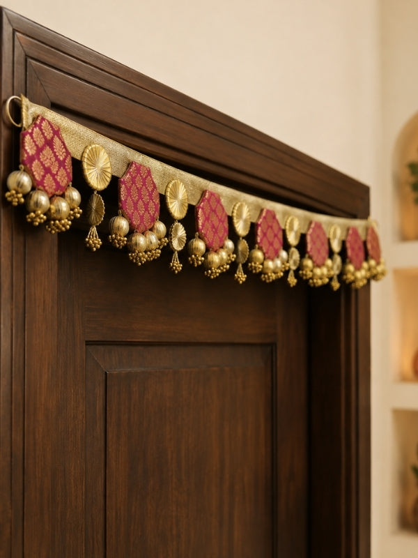 Angled view of the handcrafted toran showing the layered decorative elements and hanging structure.
