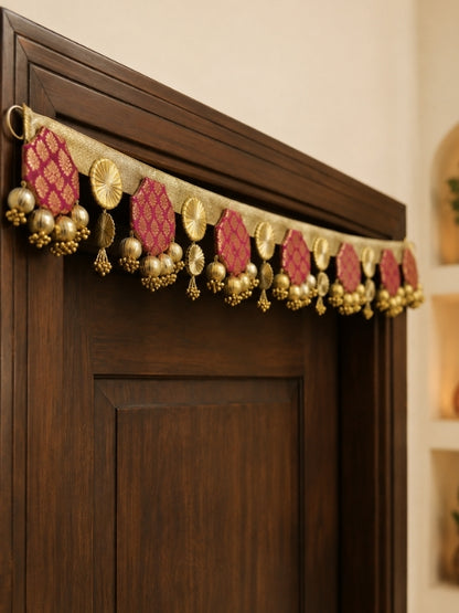 Angled view of the handcrafted toran showing the layered decorative elements and hanging structure.
