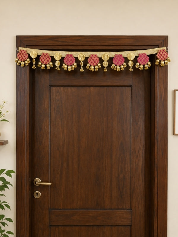 Handcrafted Gota Patti toran displayed above a home entrance during a festive celebration.
