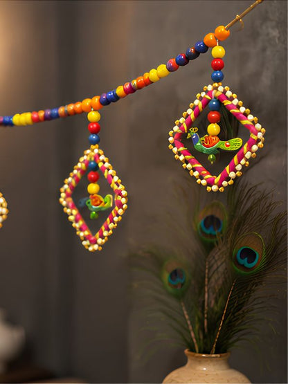 Angled view of the handcrafted Bandarwal door hanging displaying its decorative arrangement, bead work, and overall width.
