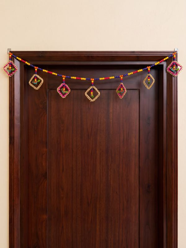 Close-up of the handcrafted Bandarwal showing decorative wooden pieces, bead detailing, and handcrafted finishing.