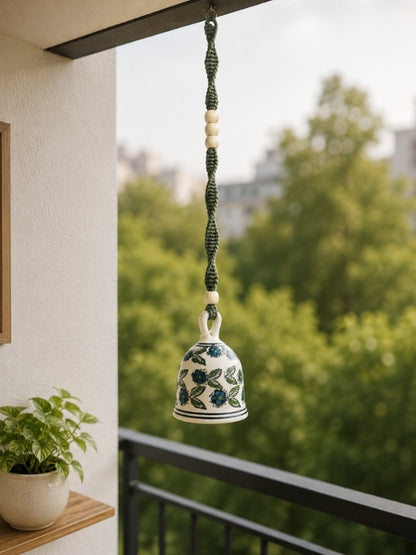 Handcrafted ceramic macramé bell hanging displayed at a home entrance or balcony, adding warmth and handcrafted elegance to the space.
