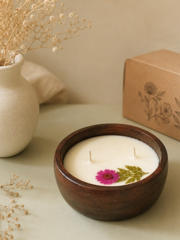 Handcrafted decorative soy wax candle featuring naturally dried Pink flower embellishments, designed for home décor and gifting.
