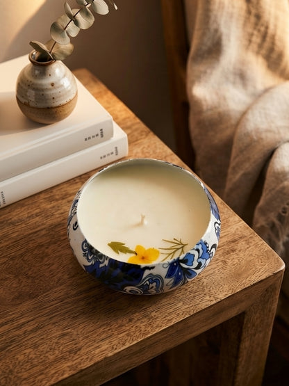 Handcrafted soy wax candle decorated with naturally dried yellow flowers, designed for home décor, gifting, and creating a warm ambience.
