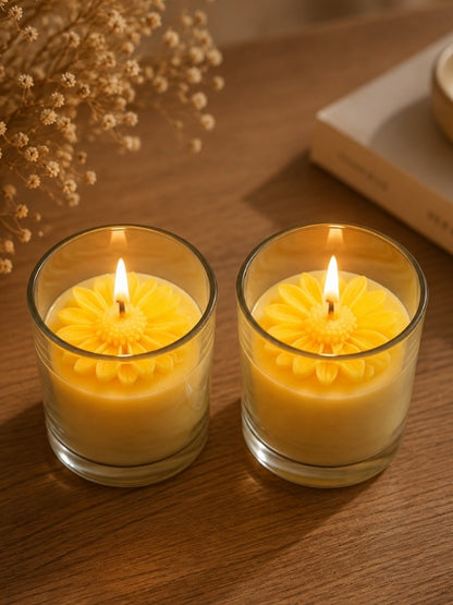 Handcrafted yellow soy wax candle displayed on a dining table, adding warmth and handcrafted charm to the décor.
