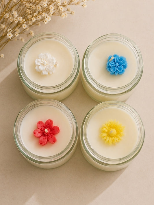Set of four handcrafted soy wax candles arranged together, featuring decorative finishes and designed for home décor and gifting.
