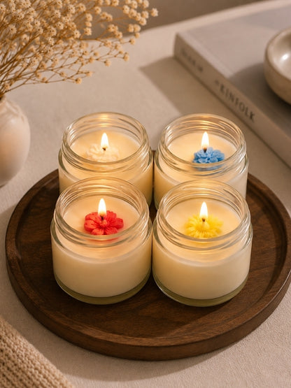 Set of four handcrafted soy wax candles displayed as a decorative centrepiece on a coffee table, creating a warm and inviting ambience.
